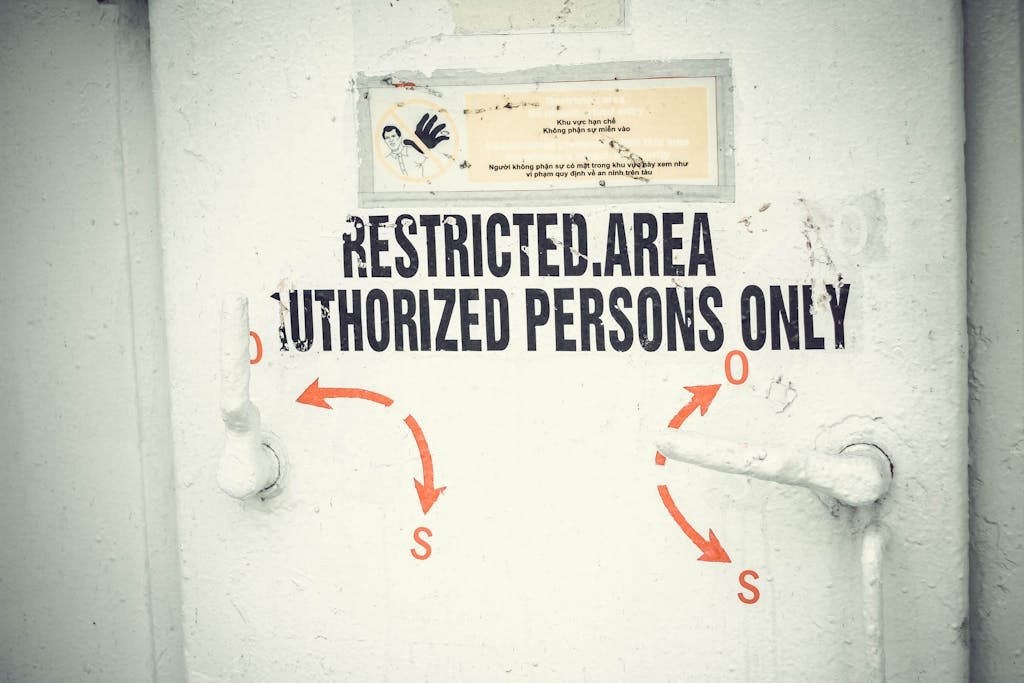 Close-up of a restricted area door with signage emphasizing authorized access only.